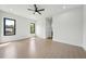 Spacious bedroom featuring recessed lights, ceiling fan, and neutral walls, with a view to outdoors at 155 Westbrook St, Buford, GA 30518