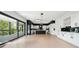 Open concept kitchen area with stainless steel appliances, hardwood floors, and sliding glass door at 155 Westbrook St, Buford, GA 30518