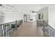 Open living room with modern railing, built-in shelving, a fireplace and large picture windows at 155 Westbrook St, Buford, GA 30518