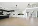 Bright, open-concept living space with kitchen, stairs and an open entry at 155 Westbrook St, Buford, GA 30518