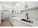 Functional walk-in pantry with ample storage and counter space, complemented by white cabinets at 155 Westbrook St, Buford, GA 30518