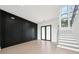 Modern staircase with gray treads, leads to the second floor of a luxurious home at 155 Westbrook St, Buford, GA 30518