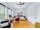 Bright bedroom with hardwood floors, a ceiling fan, large windows, and a spacious layout, providing ample natural light at 230 Bradberry Sw St # 9, Atlanta, GA 30313