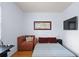 Cozy bedroom with warm hardwood floors, a corner sofa and a neutral color palette, promoting relaxation and comfort at 230 Bradberry Sw St # 9, Atlanta, GA 30313