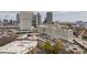 An aerial view showcasing various commercial buildings, parking lots, and mature trees in the city at 230 Bradberry Sw St # 9, Atlanta, GA 30313
