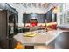 Modern kitchen with stainless steel appliances, dark cabinets, and unique decorative touches, a chef's creative haven at 230 Bradberry Sw St # 9, Atlanta, GA 30313