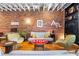 Comfortable living room with exposed brick and eclectic decor, hardwood floors, and abundant lighting at 230 Bradberry Sw St # 9, Atlanta, GA 30313