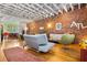 Spacious living room featuring an exposed brick wall, hardwood floors, and contemporary decor at 230 Bradberry Sw St # 9, Atlanta, GA 30313