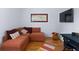 Cozy living room showcasing a comfortable sectional sofa, hardwood floors, and a decorative wall at 230 Bradberry Sw St # 9, Atlanta, GA 30313