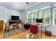 Bright home office featuring hardwood floors, natural light, and a modern desk setup at 230 Bradberry Sw St # 9, Atlanta, GA 30313