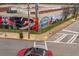 View of the street corner featuring colorful murals on the sides of storage units in the neighborhood at 230 Bradberry Sw St # 9, Atlanta, GA 30313