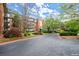 Beautiful brick apartment building with lush landscaping, a circular drive and a covered entrance at 28315 Plantation Ne Dr, Atlanta, GA 30324