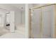 Clean bathroom with a step-up bathtub and a gold-framed shower stall at 28315 Plantation Ne Dr, Atlanta, GA 30324