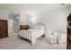 Bright bedroom featuring neutral decor, vintage furniture and recessed lighting at 28315 Plantation Ne Dr, Atlanta, GA 30324