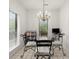 Charming breakfast nook with backyard views and chandelier at 28315 Plantation Ne Dr, Atlanta, GA 30324