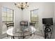 Bright breakfast nook with backyard view and chandelier at 28315 Plantation Ne Dr, Atlanta, GA 30324