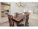 Open-concept dining room adjacent to the kitchen, featuring a chandelier and seamless flow to the living spaces at 28315 Plantation Ne Dr, Atlanta, GA 30324