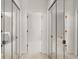 Hallway with mirrored closet doors leading to bathrooms and other rooms at 28315 Plantation Ne Dr, Atlanta, GA 30324