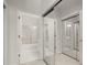 Hallway with mirrored closets doors leading to bathrooms and other rooms at 28315 Plantation Ne Dr, Atlanta, GA 30324