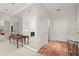 Hallway with full wall mirror, marble floor, and furniture table at 28315 Plantation Ne Dr, Atlanta, GA 30324