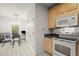 Charming eat-in kitchen with natural wood cabinets and stainless steel appliances at 28315 Plantation Ne Dr, Atlanta, GA 30324