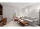 Cozy sitting room with a gray sofa, pink armchair, and a view of the outdoors at 28315 Plantation Ne Dr, Atlanta, GA 30324