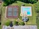 Aerial shot showcasing the community pool, tennis courts and clubhouse, perfect for recreation and relaxation at 1135 Azalea Cir, Conyers, GA 30013