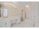 Bright bathroom featuring double sinks and a shower/tub combination at 1135 Azalea Cir, Conyers, GA 30013