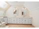 Bright bathroom with skylight, dual sinks, ample counter space, and vanity seating at 1135 Azalea Cir, Conyers, GA 30013