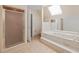 Bathroom features walk-in shower, soaking tub, and a skylight at 1135 Azalea Cir, Conyers, GA 30013