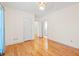 Bedroom featuring wood floors with a peek into an attached bathroom at 1135 Azalea Cir, Conyers, GA 30013