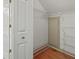 Walk-in closet features wire shelving and hardwood flooring at 1135 Azalea Cir, Conyers, GA 30013