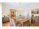 Bright dining room with elegant chandelier and French doors leading to other rooms at 1135 Azalea Cir, Conyers, GA 30013