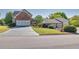 Well-maintained home with a brick facade, lush lawn, and an attached three-car garage at 1135 Azalea Cir, Conyers, GA 30013
