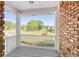 Inviting front porch showcasing brick accent and lovely neighborhood views at 1135 Azalea Cir, Conyers, GA 30013