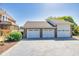 Detached three-car garage with brick exterior, matching the home's design, offers ample parking and storage at 1135 Azalea Cir, Conyers, GA 30013