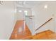 Hallway featuring wood floors and an ornate window in the back door at 1135 Azalea Cir, Conyers, GA 30013