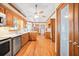 Spacious kitchen featuring wood cabinetry, stainless steel appliances, and hardwood floors at 1135 Azalea Cir, Conyers, GA 30013