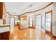 Sunlit kitchen with hardwood floors, an island, pendant lighting, and modern appliances for a stylish and functional space at 1135 Azalea Cir, Conyers, GA 30013