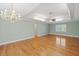 Spacious living room with hardwood floors, coffered ceiling, and chandelier at 1135 Azalea Cir, Conyers, GA 30013