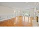 Bright living room with hardwood floors, a fireplace, and large windows at 1135 Azalea Cir, Conyers, GA 30013