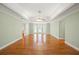 Bright living room with hardwood flooring, tray ceiling and a bay window at 1135 Azalea Cir, Conyers, GA 30013