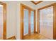 Intricately etched pantry doors in hallway showcasing the dining room at 1135 Azalea Cir, Conyers, GA 30013