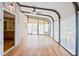 Bright sunroom featuring a brick accent wall, lots of natural light, and wood flooring at 1135 Azalea Cir, Conyers, GA 30013