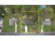Aerial view highlighting property with mature trees, lush landscaping, and long driveway at 1311 Maple Street Se, Conyers, GA 30013