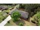 Aerial view of home with mature trees, lush landscaping, and a long driveway at 1311 Maple Street Se, Conyers, GA 30013
