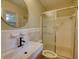Functional bathroom featuring modern fixtures including sink, mirror, toilet, and walk-in shower at 1311 Maple Street Se, Conyers, GA 30013
