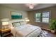 Comfortable bedroom featuring soft, neutral colors, hardwood floors, and comfortable bedding and accents at 1311 Maple Street Se, Conyers, GA 30013