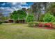 Beautiful home with a well-manicured lawn and colorful flowering shrubbery at 1311 Maple Street Se, Conyers, GA 30013
