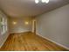 Spacious living room with new hardwood floors, and natural light at 1311 Maple Street Se, Conyers, GA 30013